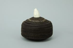 Image of round baleen basket with large polar bear's head finial 